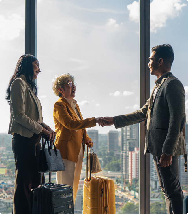 Dwellworks Living - Solutions for Global Corporate Relocation - professional handshake with city in background